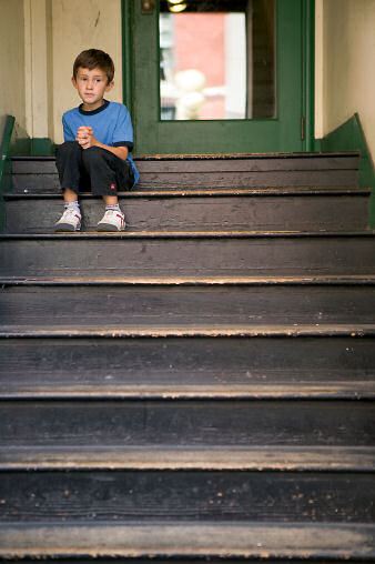 Little Boy Sitting on Stairs